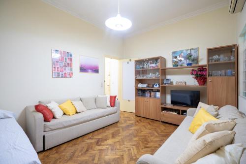 a living room with two couches and a television at Kipseli 1 bedroom 5 persons apartment by MPS in Athens