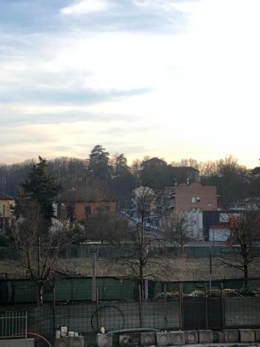 a view of a city with trees and buildings at Ferriera 8 in Novi Ligure