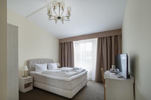Postel nebo postele na pokoji v ubytování Upper Room Hotel Kurfürstendamm