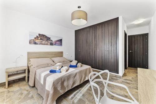 Casa Estela - Villasexperience tesisinde bir odada yatak veya yataklar