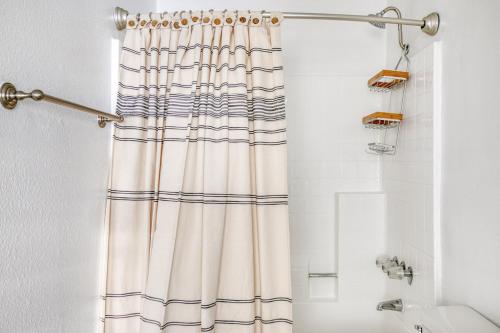a bathroom with a shower with a shower curtain at Sherman Oaks 1BR nr WF TJ nr Ventura Blvd LAX-538 in Los Angeles
