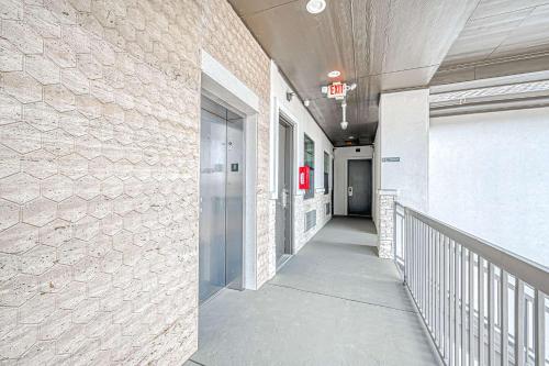 a hallway of a building with a walkway at Comfeeni Inn and Suites in Houston