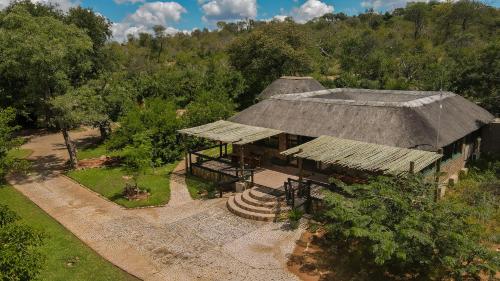 an overhead view of a house with a roof at Baluleni Safari Lodge in Grietjie Game Reserve