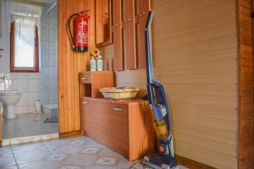 a room with a mop in the corner of a bathroom at Romantic Cottage In Real Nature in Radeče