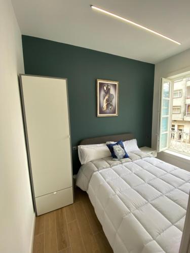 a bedroom with a large white bed and a window at APART_SANVICENTE 6 in Vigo