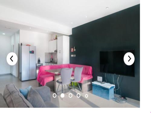 a living room with a couch and a table at Apartments Andrea in Solin