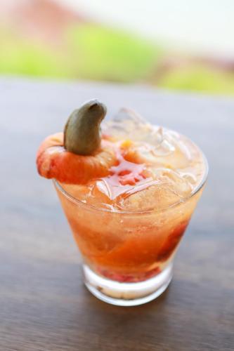 a drink with a pickle on top at Chalé das Águas in Igaratá