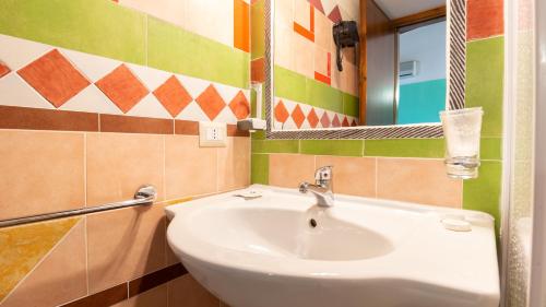 a bathroom with a sink and a mirror at Sa Mola in Bonarcado