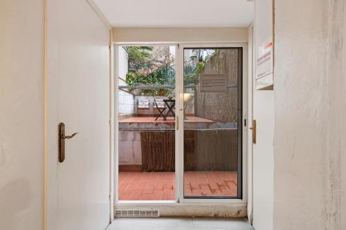 an open door with a view of a patio at Flateli Fabra in Barcelona