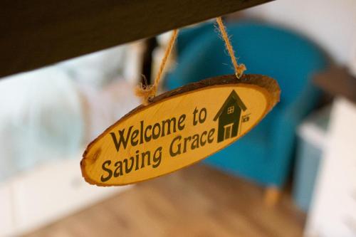 a sign that says welcome to saving garage in at Saving Grace with private hot tub in Bawdeswell