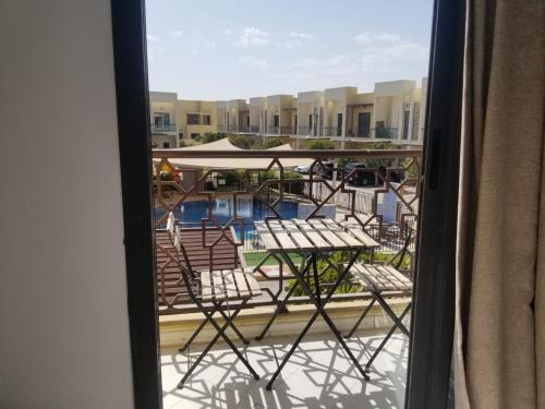 a view of a balcony with chairs and a pool at Spacious 3BR Townhouse Villa in Dubai