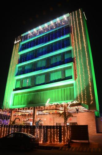 a building with christmas lights in front of it at Hotel Ramaya in Gwalior