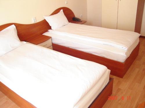 Postel nebo postele na pokoji v ubytování hotel Harmony