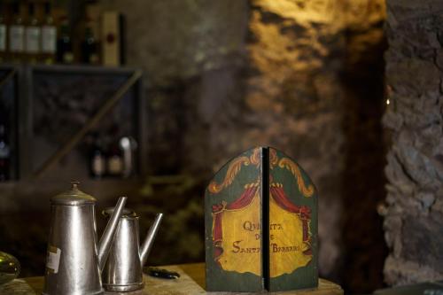 a bottle of wine sitting on top of a table at Quinta de Santa Barbara by Heavens Sleepy in Constância