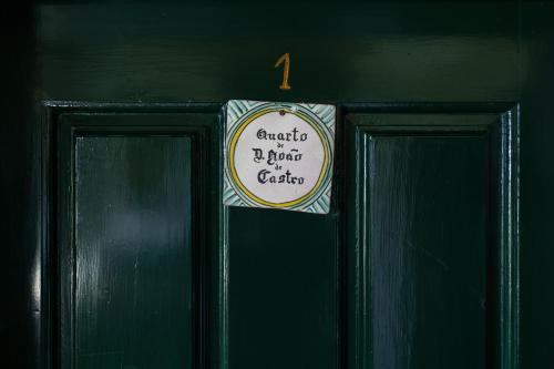 a sign on the door of a green house at Quinta de Santa Barbara by Heavens Sleepy in Constância