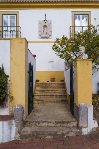 a stairway leading up to a building with a gate at Quinta de Santa Barbara by Heavens Sleepy in Constância
