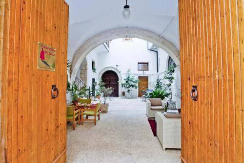 an open door to a room with tables and chairs at B&B Il Marchese Del Grillo in Sulmona