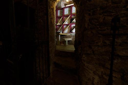 a dark hallway with a window in a building at Quinta de Santa Barbara by Heavens Sleepy in Constância