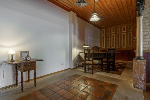 a living room with a table and chairs and a dining room at Quinta de Santa Barbara by Heavens Sleepy in Constância