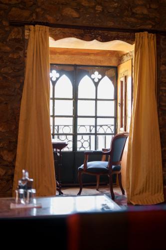 a room with a chair and a window at Quinta de Santa Barbara by Heavens Sleepy in Constância