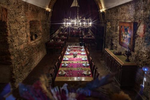an overhead view of a long table in a restaurant at Quinta de Santa Barbara by Heavens Sleepy in Constância