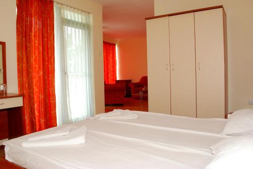 Postel nebo postele na pokoji v ubytování hotel Harmony