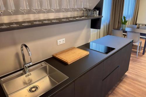 a kitchen with a sink and a counter top at Trautes Quartier in Bad Gleichenberg