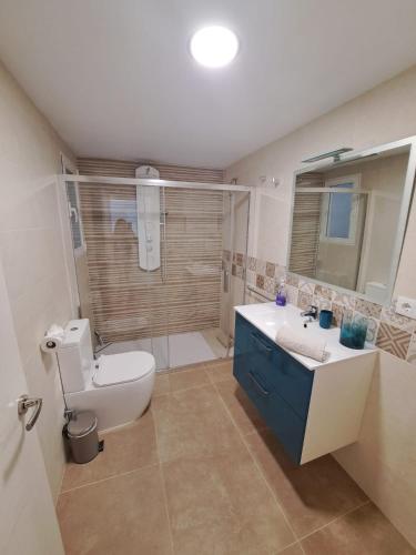 a bathroom with a toilet and a sink and a shower at CASA ARBOL DE VIDA in Altea