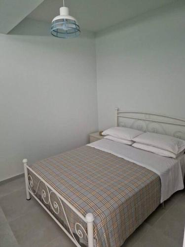 Ένα ή περισσότερα κρεβάτια σε δωμάτιο στο Leta apartament
