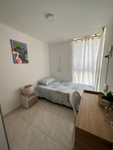Ένα ή περισσότερα κρεβάτια σε δωμάτιο στο Acogedor Apartamento Como en casa