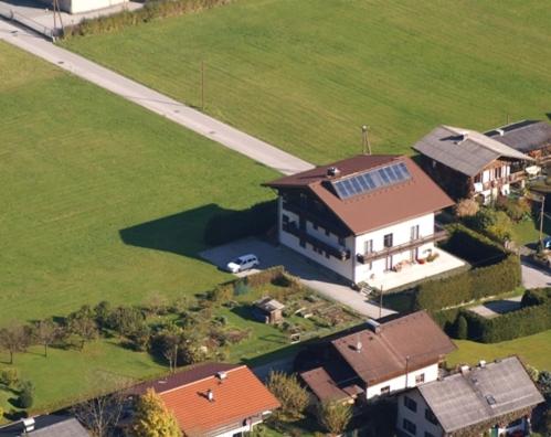 an aerial view of a large house with a yard at Pension Bergfried in Grödig
