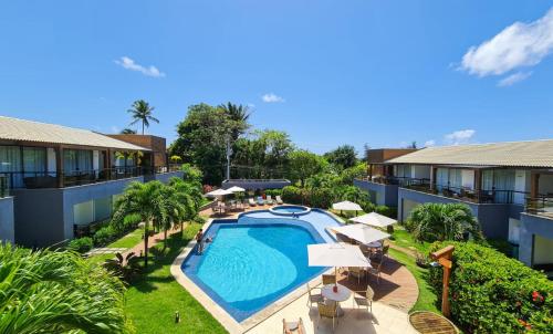 an overhead view of a pool at a resort at Imbassaí Village Solaris in Imbassai