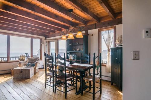 a dining room with a table and chairs at 53 Freeman Avenue Sandwich - Cape Cod in Sandwich