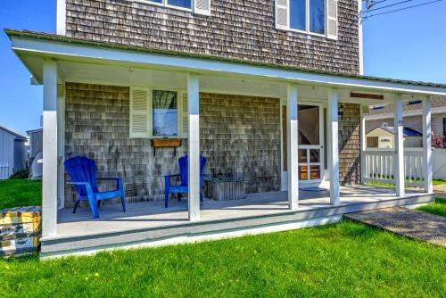 a screened porch with blue chairs on a house at 53 Freeman Avenue Sandwich - Cape Cod in Sandwich