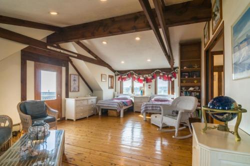 a large living room with wooden floors and furniture at 53 Freeman Avenue Sandwich - Cape Cod in Sandwich
