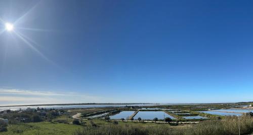 an aerial view of a river and a bridge at Vista Mar Aldeia de Marim in Marim