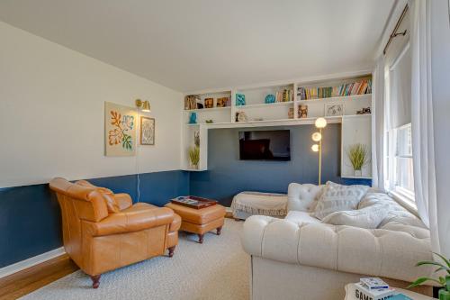a living room with a couch and a chair at The Titan - Pet-friendly Bungalow in Nashville