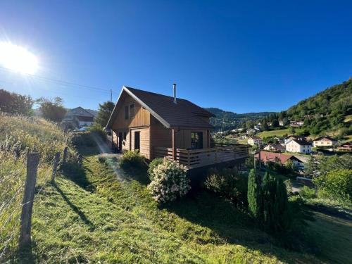 a house on the side of a hill at Casa de Monzel with 6-Person Jacuzzi & Panoramic View in La Bresse