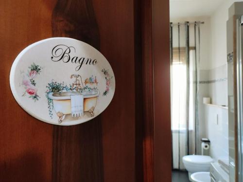 a plate of a bathroom with a sink on a wall at metro C and Tor Vergata in Rome