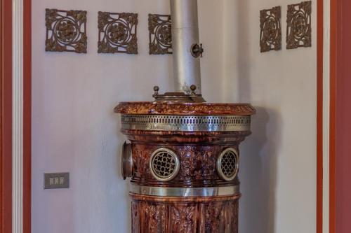 a wooden pillar with a pipe on a wall at Family Villa with Stunning Lake View by Wonderful Italy in Civenna