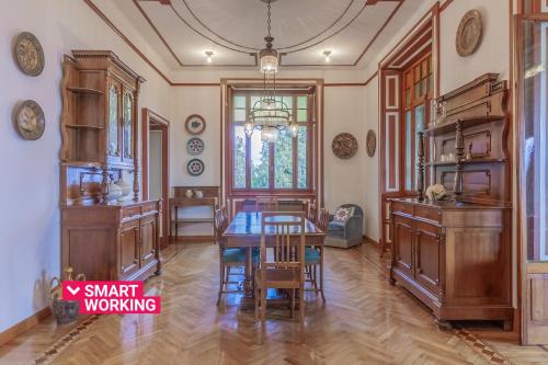 a large dining room with a table and chairs at Family Villa with Stunning Lake View by Wonderful Italy in Civenna
