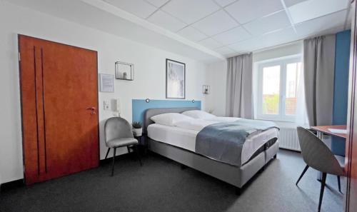 מיטה או מיטות בחדר ב-WJH Apartmentvermietung Ulm