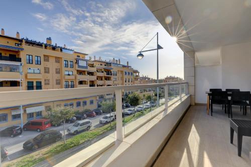 a balcony with a view of a city street at Aqua Apartments Vento, Marbella in Marbella