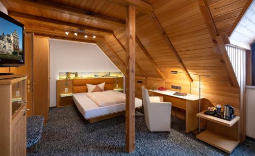Postel nebo postele na pokoji v ubytování Hotel Simonshof