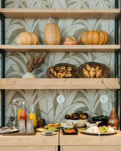a shelf filled with lots of different types of food at AlmaLusa Comporta in Comporta