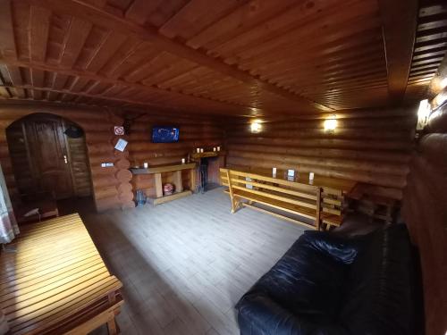 an empty room with a bench in a cabin at "У вуйка" in Uzhhorod