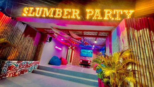 a room with a sign that reads wonder parties at Slumber Party Krabi in Ao Nang Beach