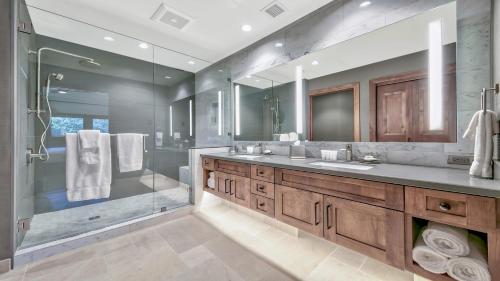 a bathroom with two sinks and a glass shower at Zalanta 325 in South Lake Tahoe