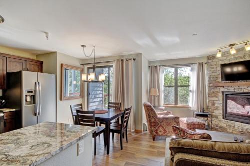 a kitchen and living room with a table and chairs at Studio Apartment in Breckenridge