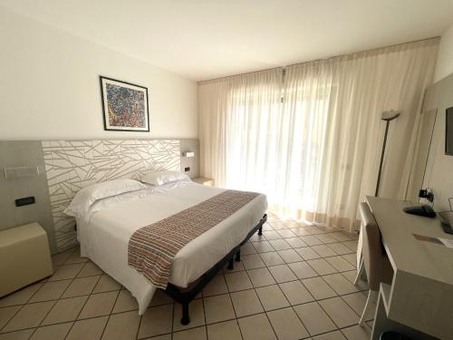 Letto o letti in una camera di Hotel Garden